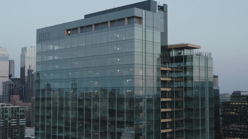 A tower block with one central larger skyscraper
