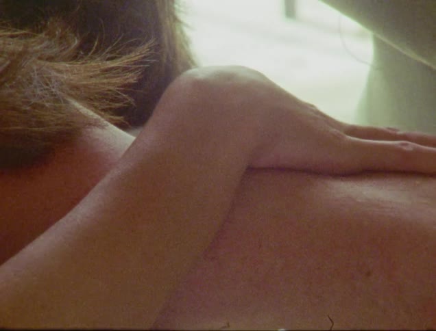 A human hand caressing another persons neck