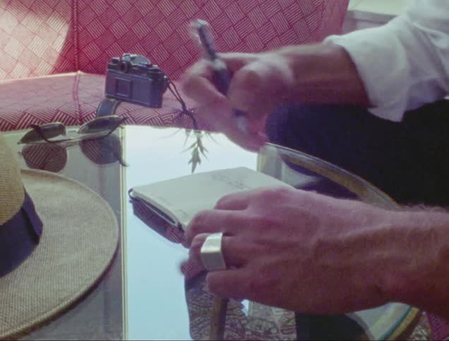 A man writing on his diary