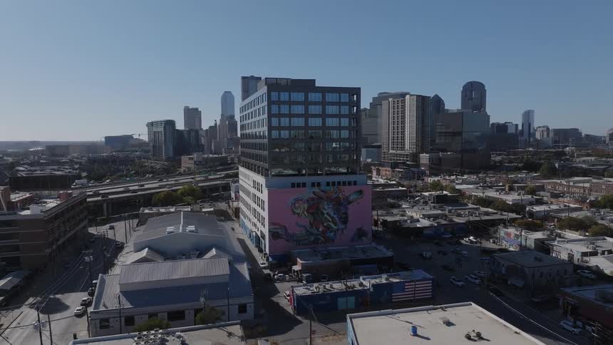 A building with art on the wall in the city during the day