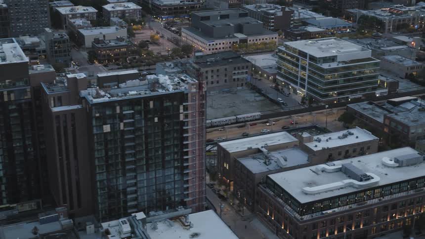 Commuter train passes through downtown on an elevated line