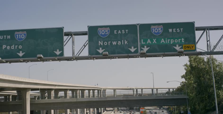 Cars drive on an urban highway