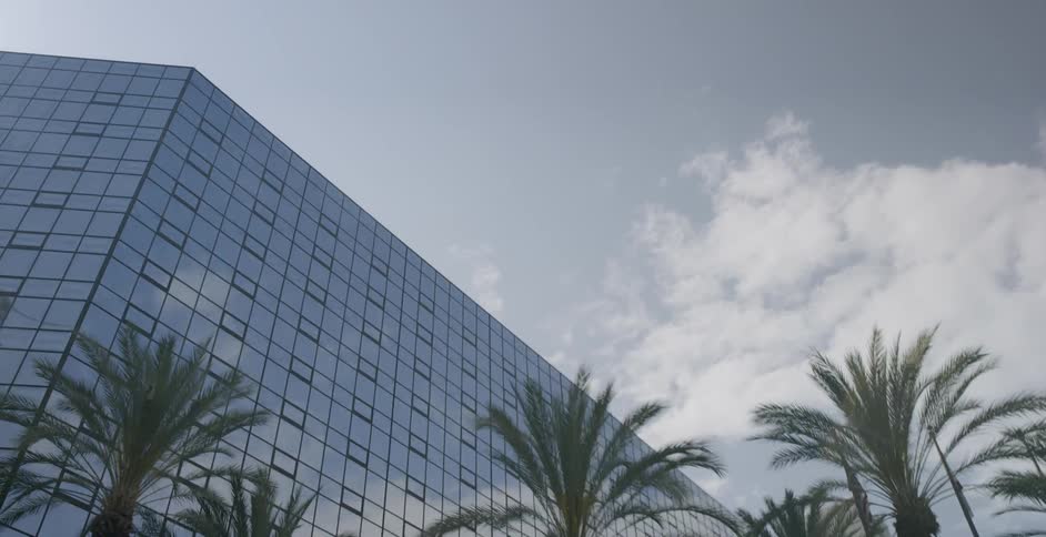 Tall trees line this building