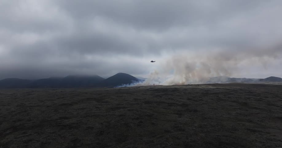 A clip of an helicopter flying through the smoke