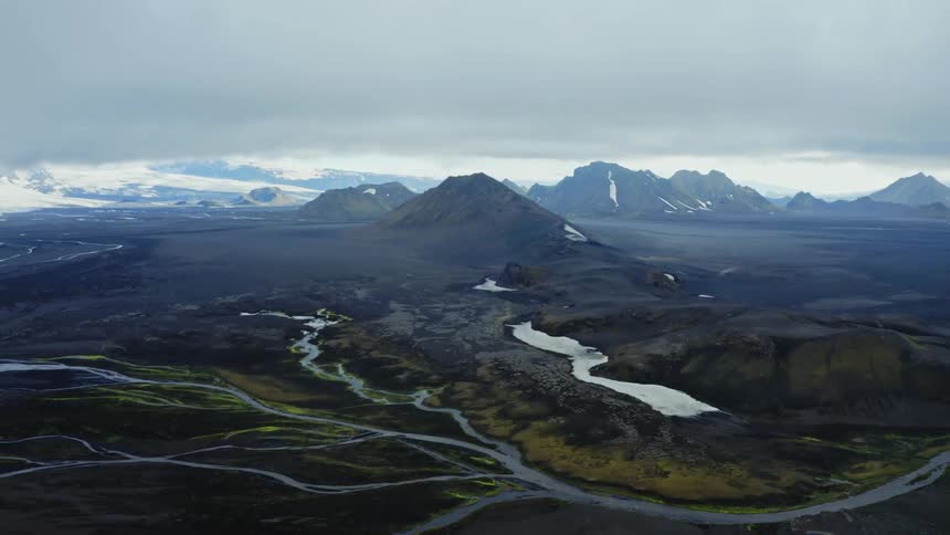 Aerial view of rivers next to the mountains