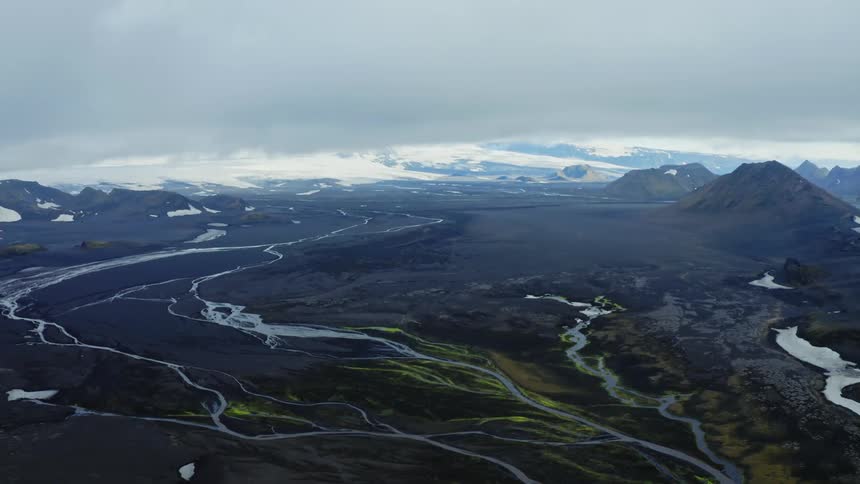 Several rivers pass through a landscape covered with green vegetation