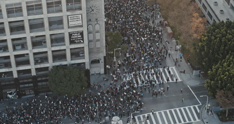 Crowd walking through the city streets