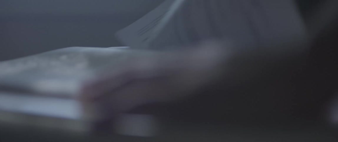 Close up of a hand turning the page of a book