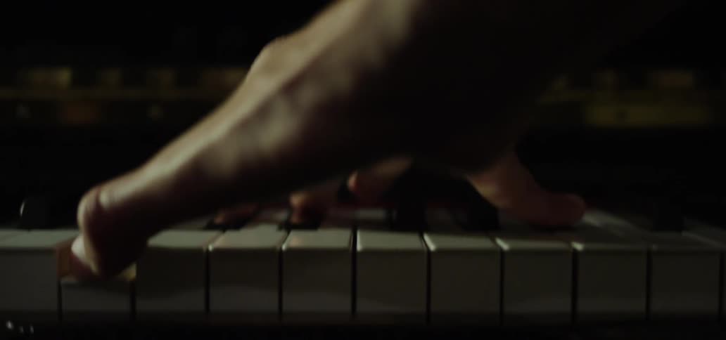 A person is playing the piano