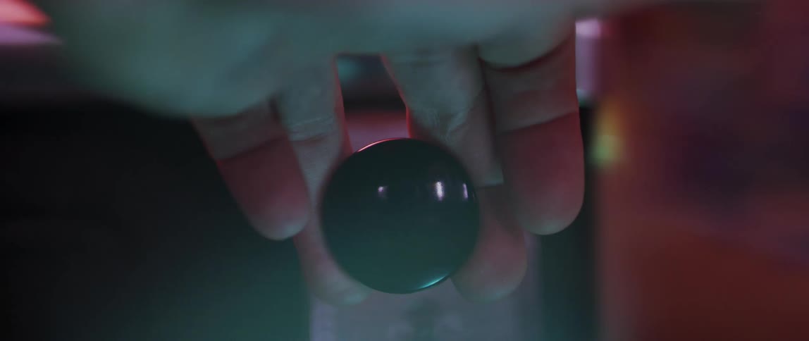Closeup of a persons hand turning and pulling a button