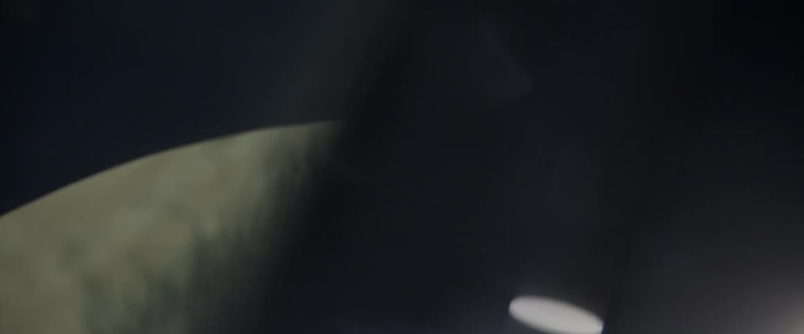 A man looks into a car window
