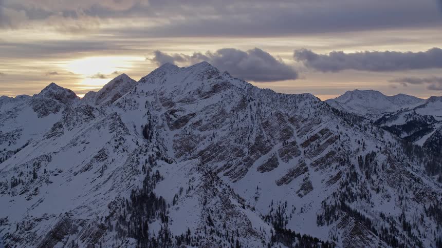 Aerial view of a snowy mountain range at morning