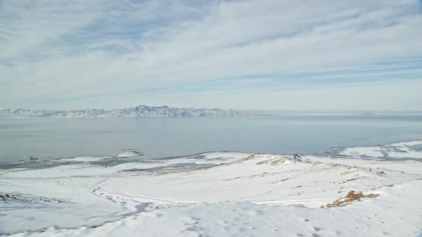 The mountains and landscape are covered in snow