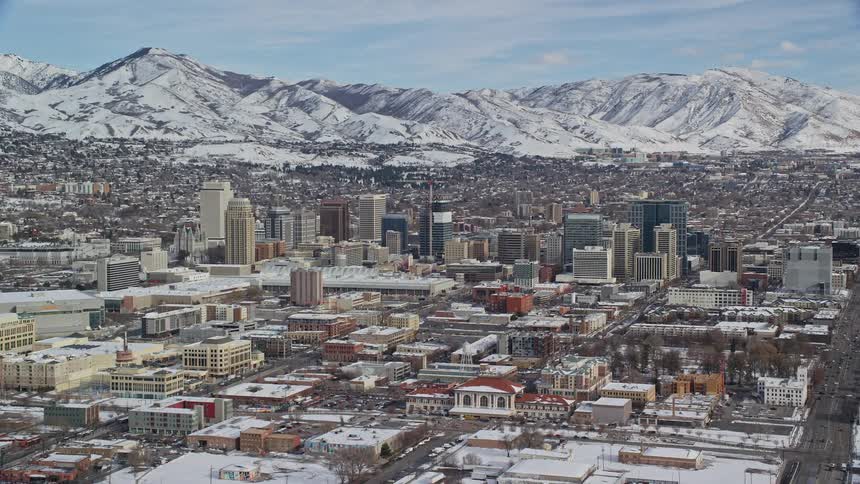 Snow covers the mountains that surround salt lake city