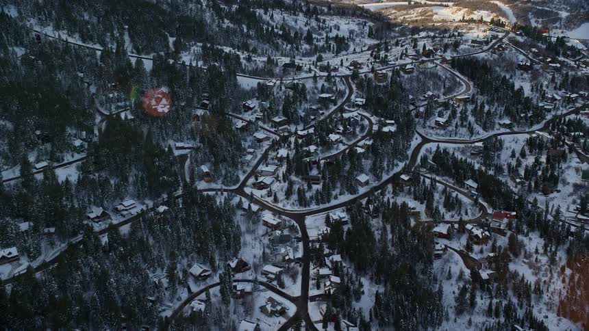 A small town is on the snow filled hills