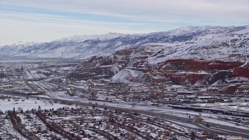 Aerial of the highway in a suburban town during winter