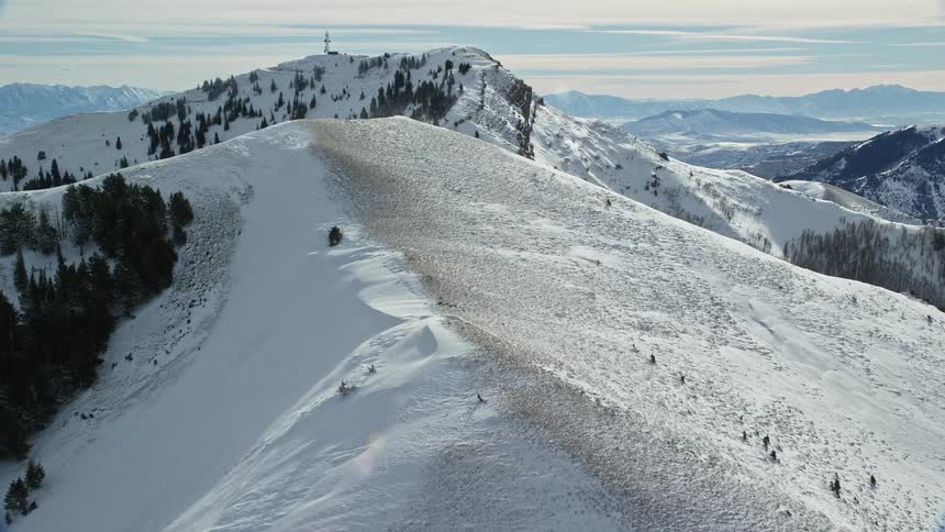 The mountains are covered in heavy snow