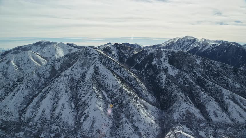 Aerial of frozen mountains during sunny days