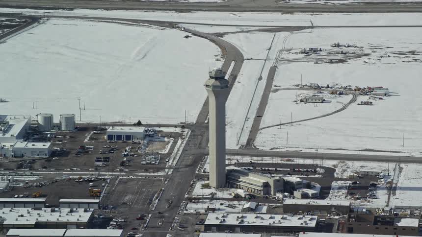 The airport runway is covered with snow