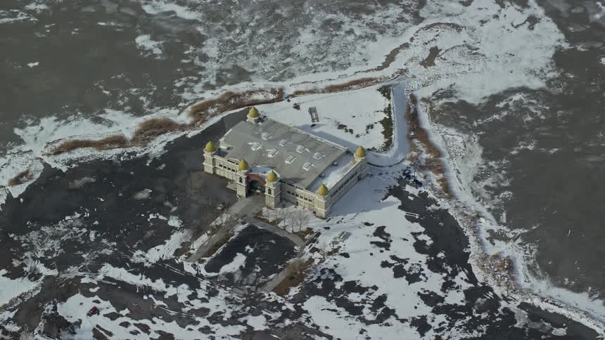 Aerial panorama of a house on snowcovered ground