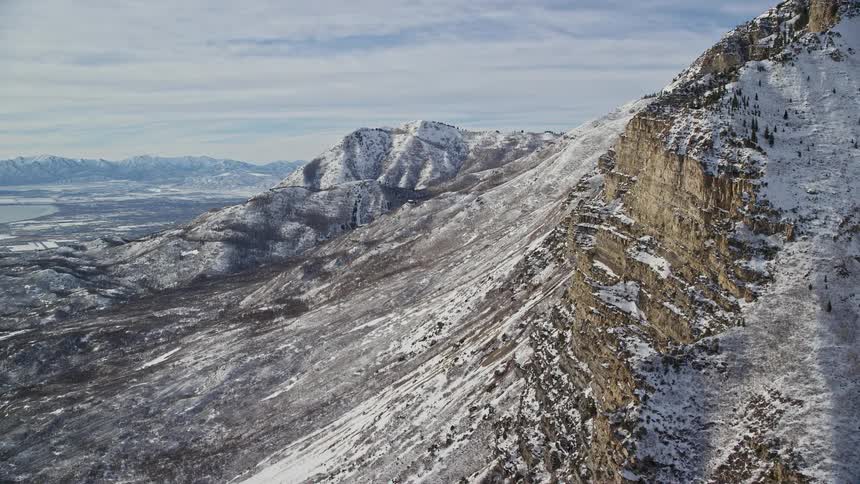 Panorama of an aerial landscape of the coastline of snowcovered mountains