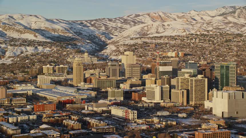 The city by the mountain is covered in snow