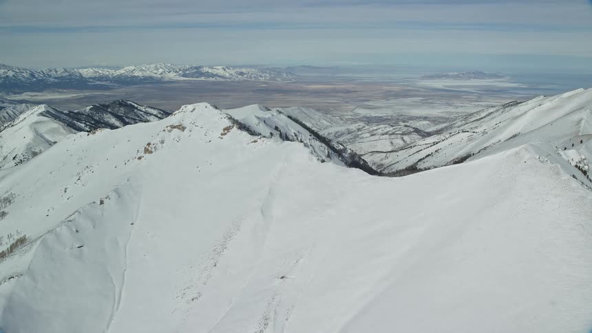 Aerial panorama of mountains and peaks covered in snow