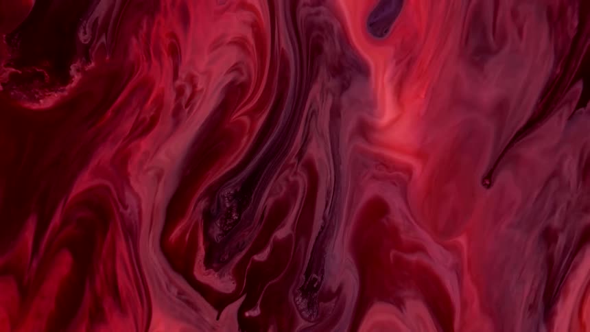 Abstract and psychedelic reddish paint flowing in lava look
