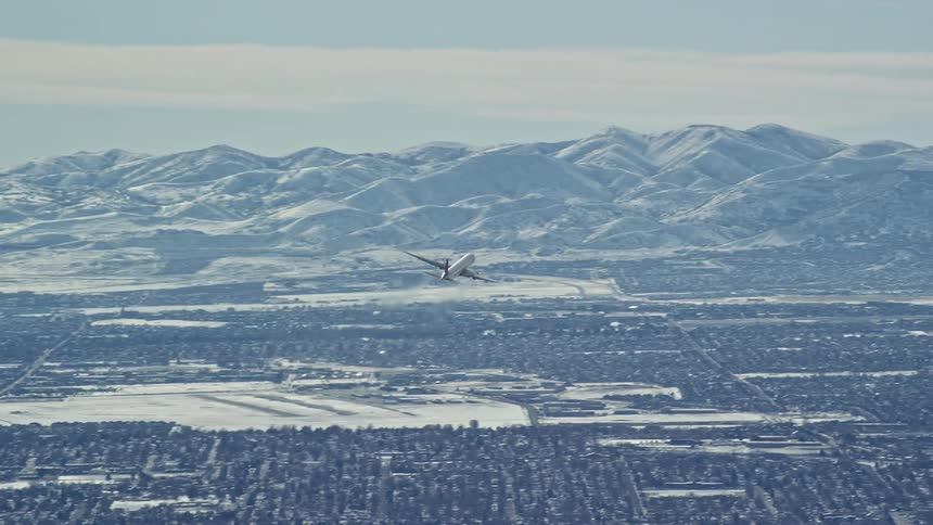A plane is flying over the town