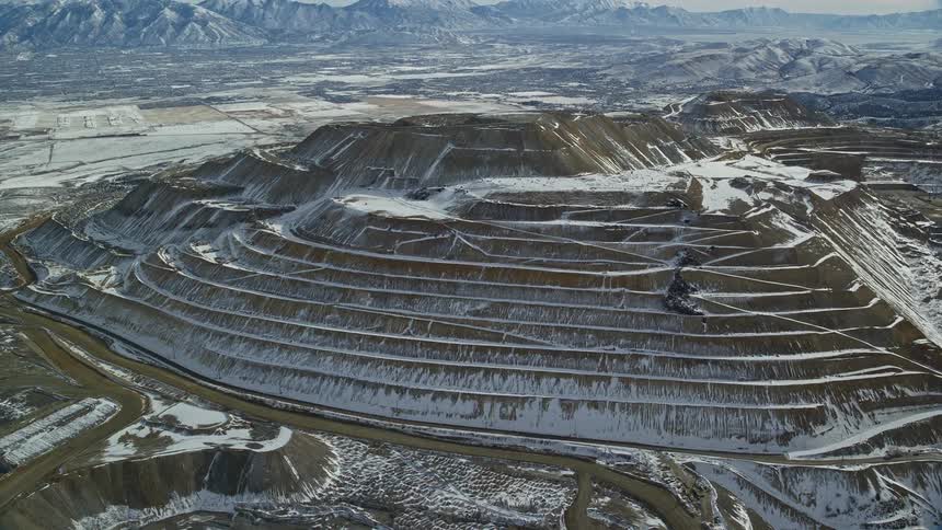 Aerial panorama of snowcovered rocky mountains and waterfalls