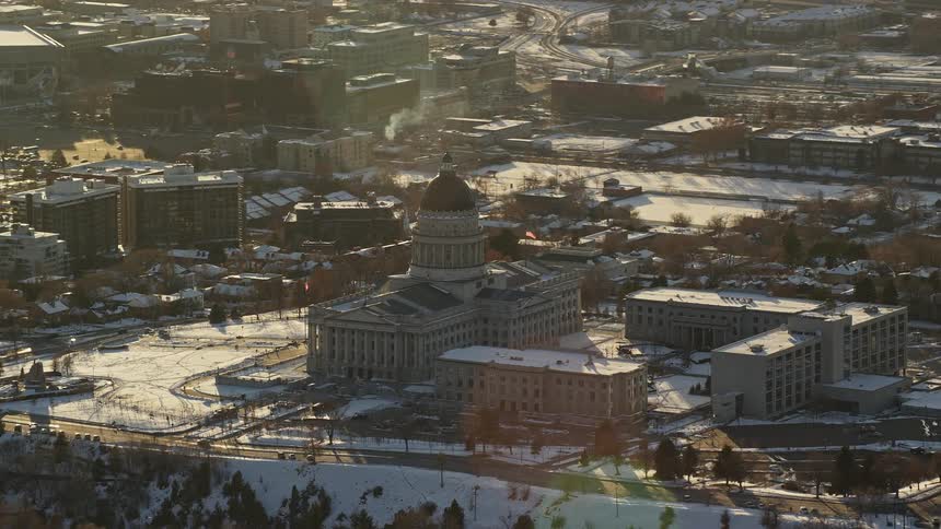 Aerial panorama of the congress building in the midst of an urban city covered with snow