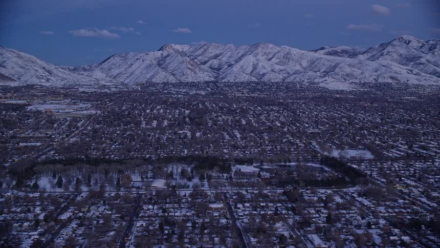 Aerial of a suburban neighborhood covered in snow during winter