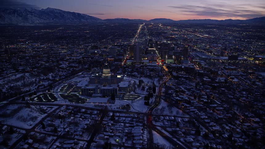 The town is covered in snow at sunset