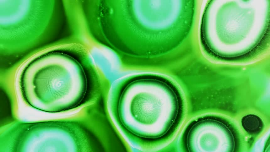 Abstract growing green organic cells made out of inks