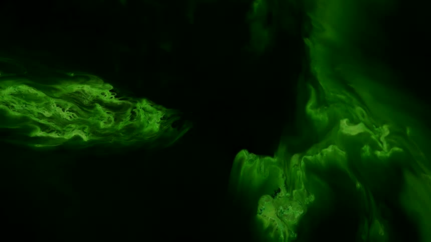 Abstract growing liquid ink cells under microscope
