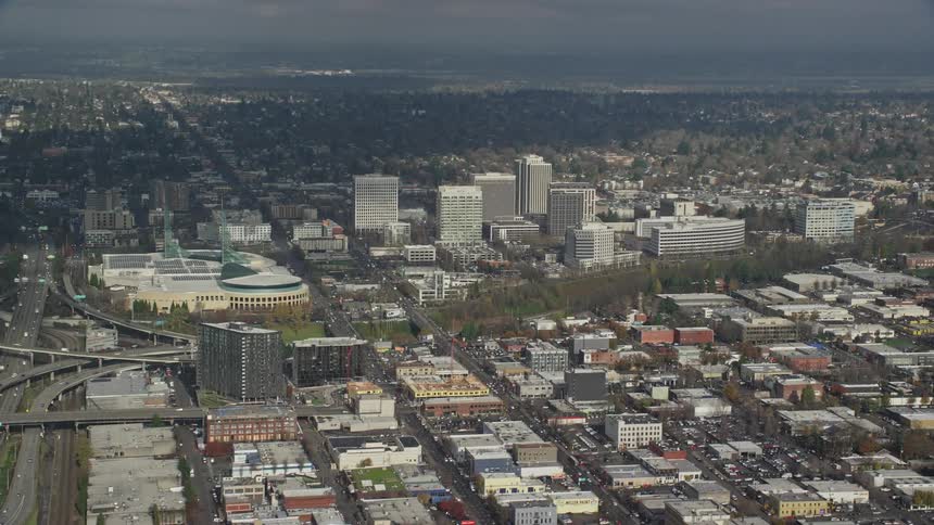 Aerial view of a suburb of a city with buildings houses and warehouses on a sunny day