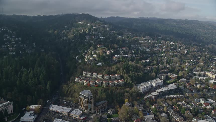 Aerial view of a city amidst natural mountains on a day