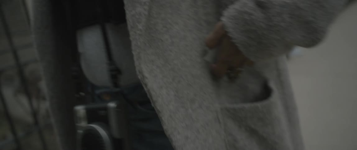 A woman puts a picture in her pocket