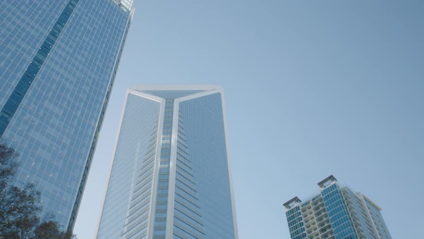 Upward view of modern skyscrapers in a metropolis on a clear and bluesky day