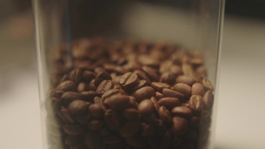 Close up of coffee beans in a glass jar