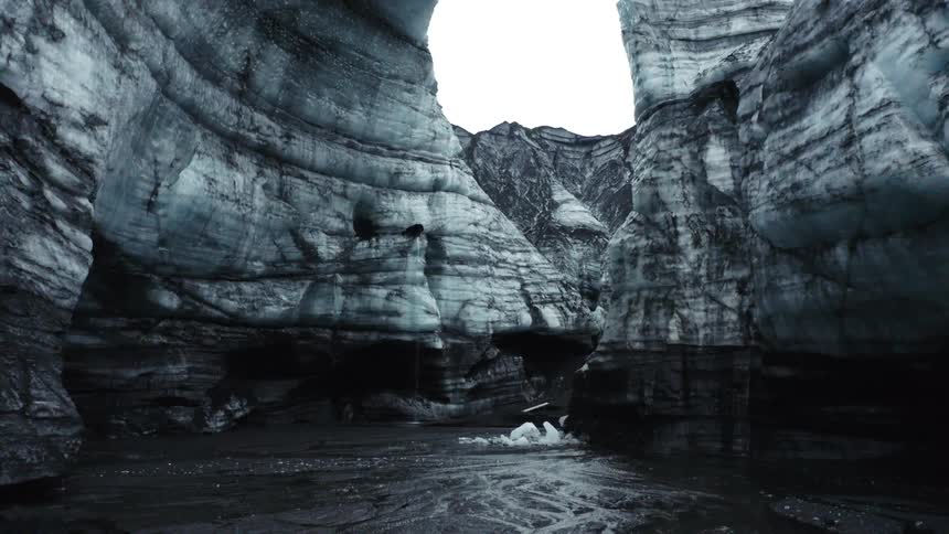 Ice cave with waterfall on cloudy days