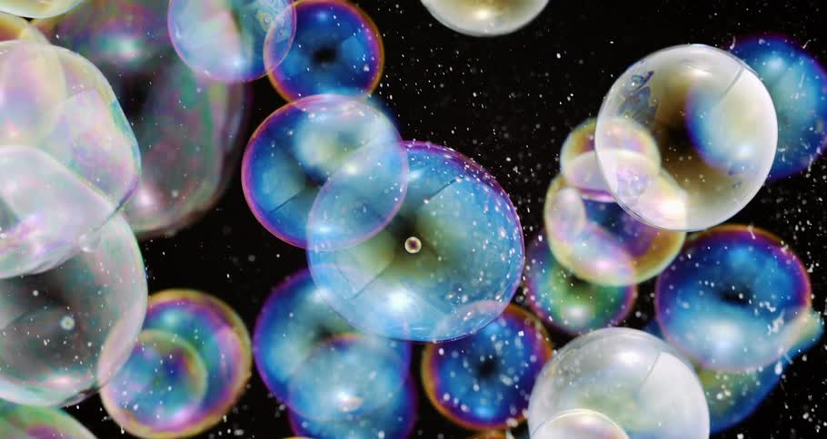Shimmering soap bubbles float in the air