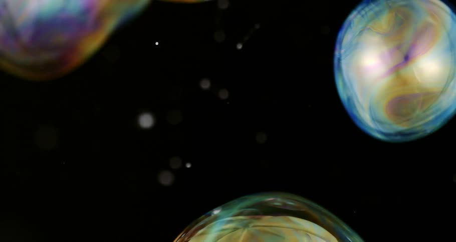 Shimmering soap bubbles float in the air