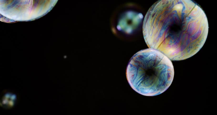 The rainbow colored bubbles float down