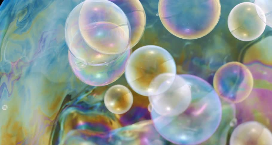 Small bubbles float around the large one