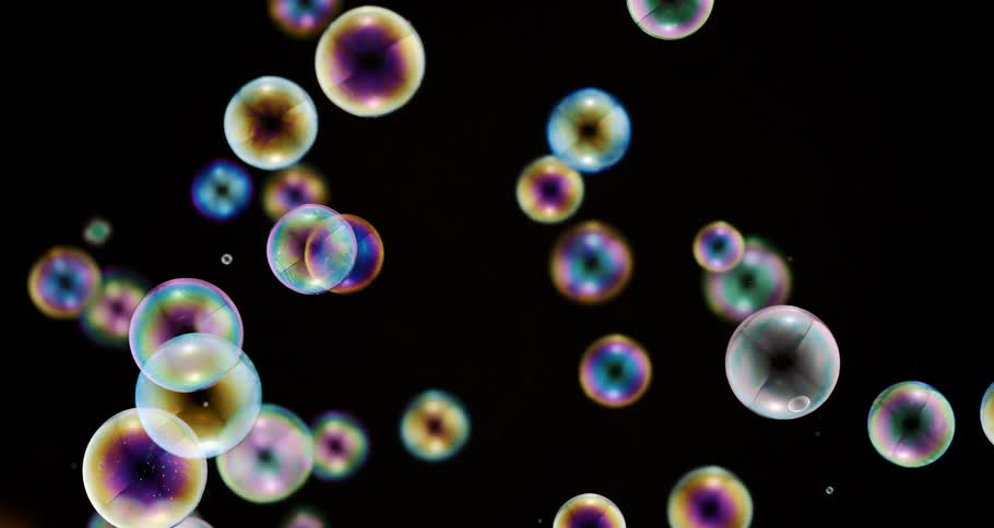 Shimmering soap bubbles float in the air