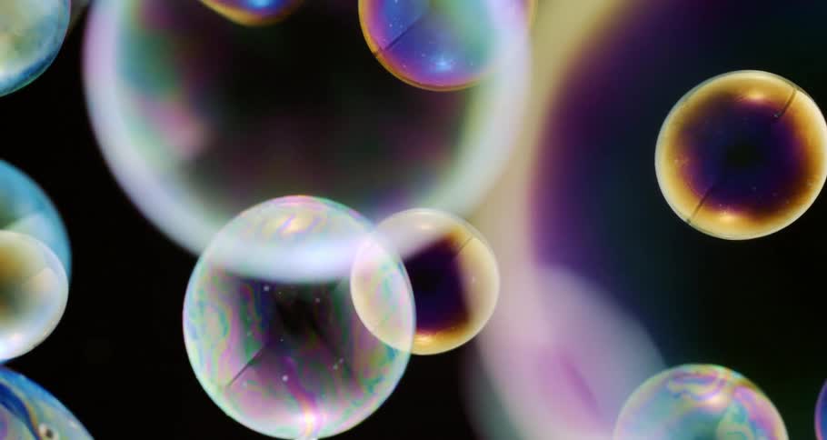 Light reflects on the floating bubbles