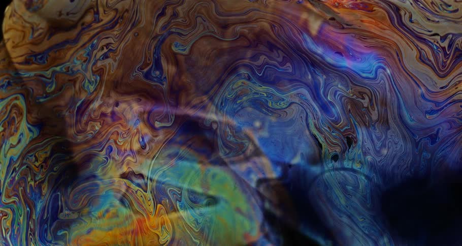 Microscopic colorful liquid bubble in slow motion