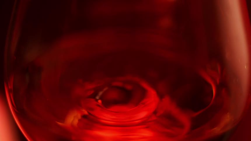 Drops of liquid falling inside a goblet