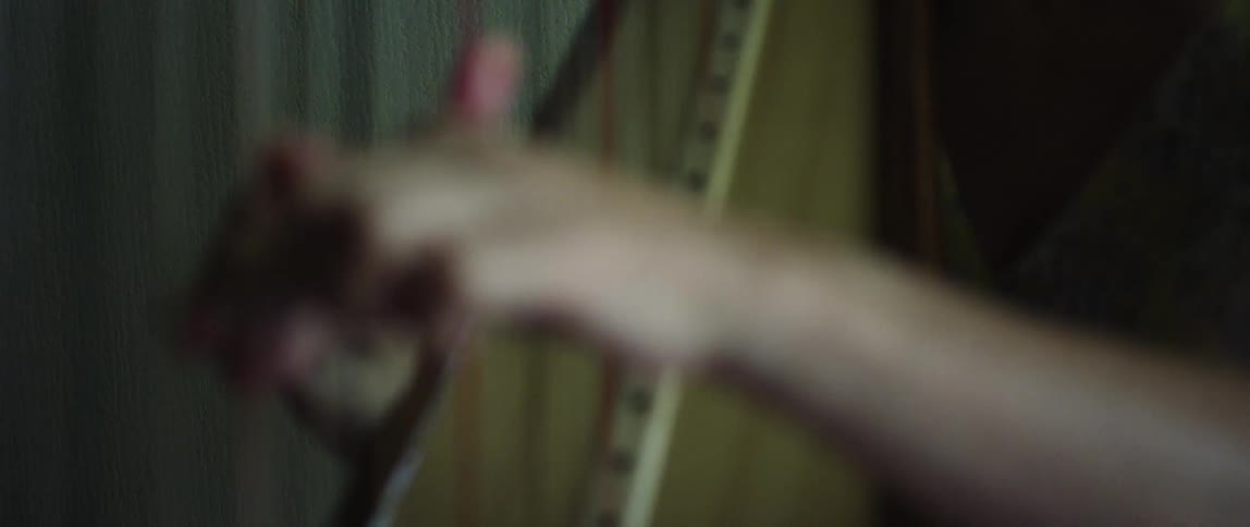 Closeup of a womans hands playing the harp